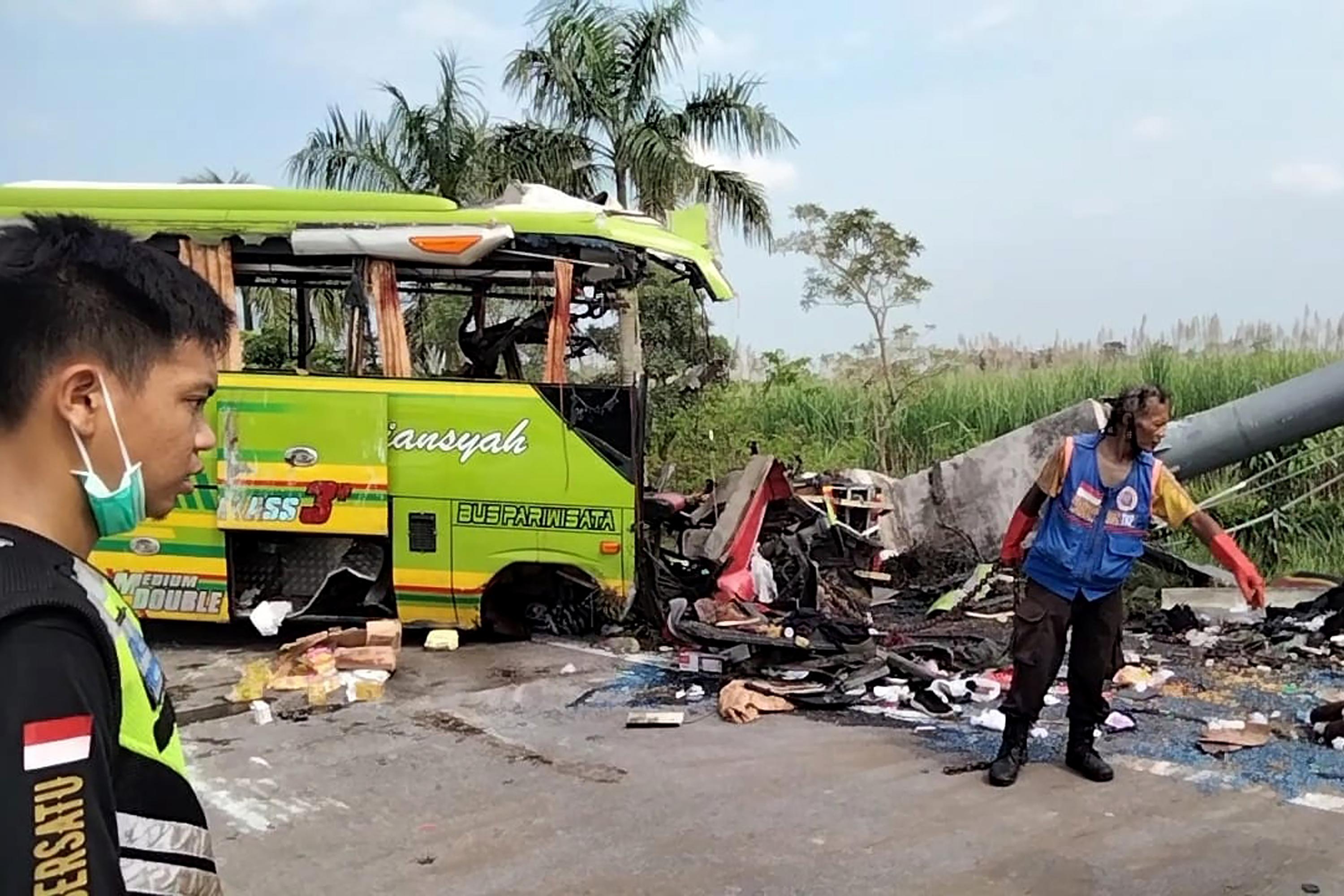 Indonesia tourist bus smashes into billboard, killing 14