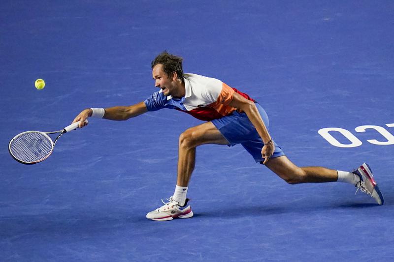 Russia's Daniil Medvedev hits a return to Spain's Rafael Nadal during their semifinal match at the Mexican Open tennis tournament in Acapulco, Mexico, Friday, Feb. 25, 2022. (AP Photo/Eduardo Verdugo)