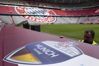 Workers prepare a sign inside the FC Bayern Munich soccer stadium Allianz Arena in Munich, Germany, Wednesday,  Nov. 9, 2022. The Tampa Bay Buccaneers are set to play the Seattle Seahawks in an NFL game at the Allianz Arena in Munich on Sunday. (AP Photo/Matthias Schrader)