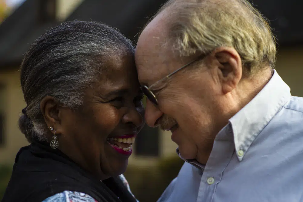 Paul Fleisher and his wife Debra are seen Monday, Dec. 5, 2022, at their home in Henrico County, Va. The Fleisher's have been married since 1975, seven years after the U.S. Supreme Court struck down laws prohibiting interracial marriage in the landmark case Loving v. Virginia. (AP Photo/John C. Clark)