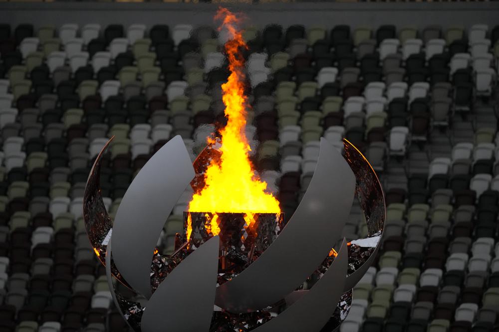 The Olympic flame burns prior to the closing ceremony in the Olympic Stadium at the 2020 Summer Olympics, Sunday, Aug. 8, 2021, in Tokyo, Japan. (AP Photo/Aaron Favila)