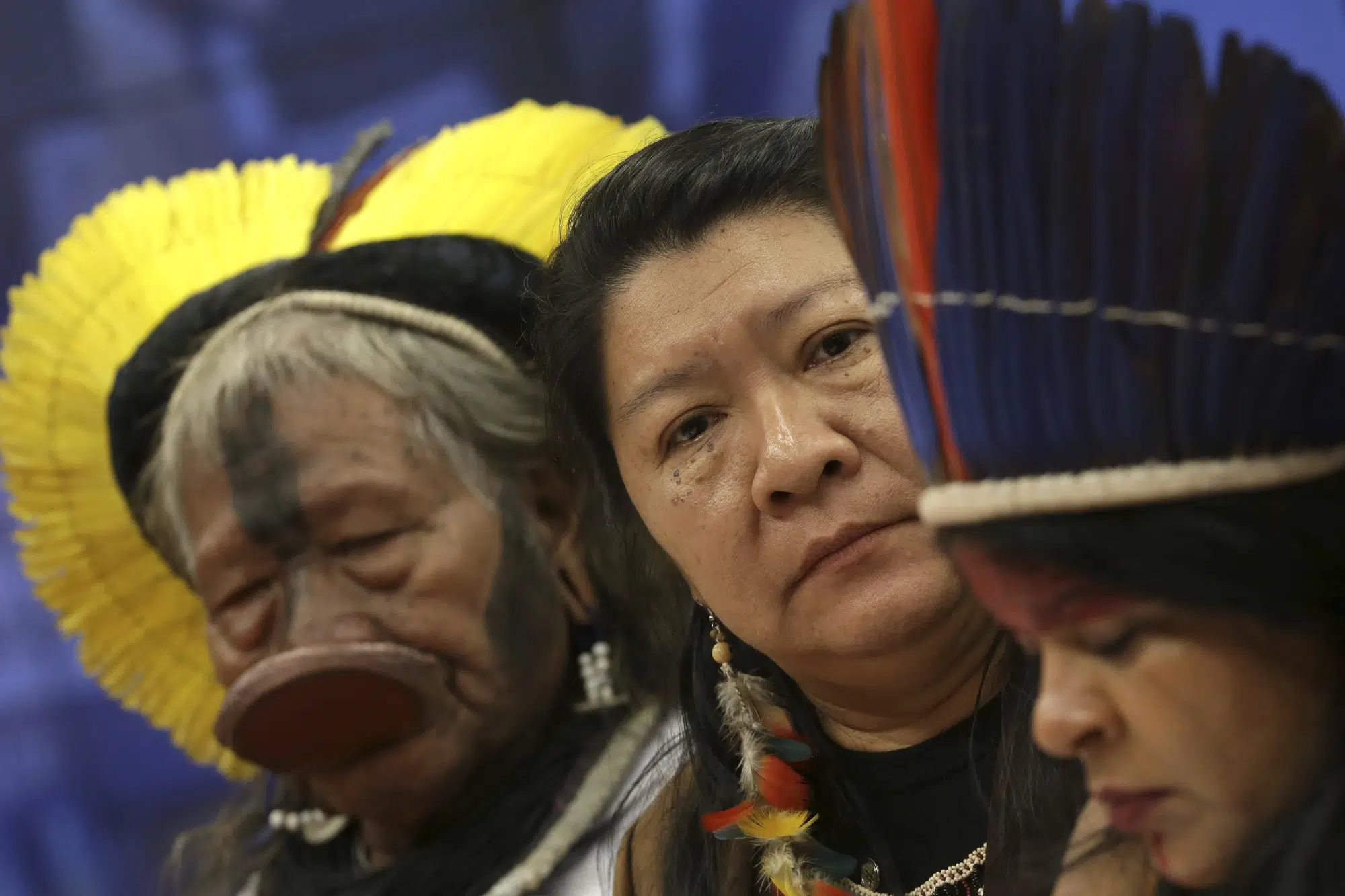 FILE - Kayapo leader Raoni Metuktire, from left, Joenia Wapichana, the first indigenous congresswoman to be elected to Brazil's lower house, and indigenous leader Sonia Guajajara, attend a meeting with lawmakers to discuss land rights and the Chamber of Deputies' role in the protection of the environment in Brasilia, Brazil, Thursday, April 25, 2019. Environmentalists, Indigenous people and voters sympathetic to their causes were important to Luiz Inácio da Silva's election to a third term as Brazil's president. (AP Photo/Eraldo Peres, file)