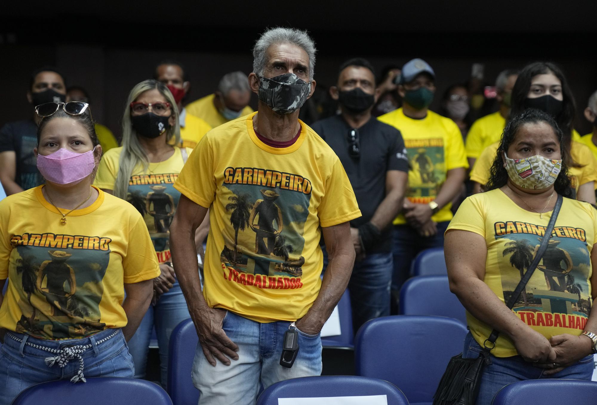 Gold miners attend a public hearing at the Chamber of Deputies in Boa Vista, Brazil, Thursday, Nov. 4, 2021. Members of the Association of Independent Prospectors of Roraima gathered for a public hearing to protest recent operations by environmental agency Ibama and Federal Police that destroyed mining equipment, during which a miner was shot and killed. (AP Photo/Andre Penner)