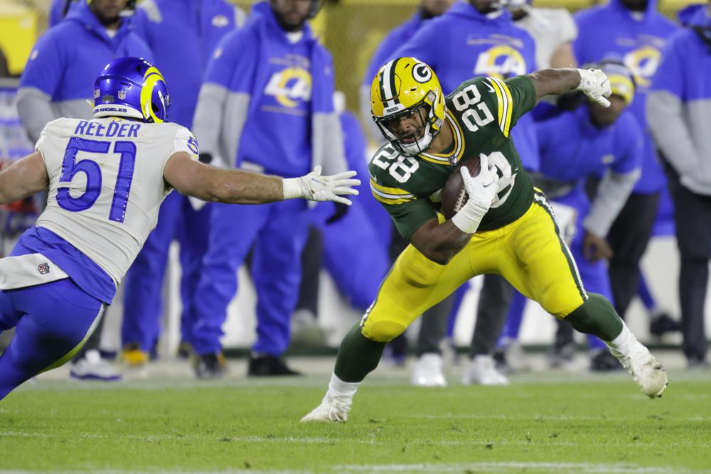 PFF Grades For The Packers Big Statement Win Against The Rams 6 Green Bay Packers' AJ Dillon tries to run past Los Angeles Rams' Troy Reeder during the second half of an NFL football game Sunday, Nov. 28, 2021, in Green Bay, Wis. (AP Photo/Matt Ludtke)