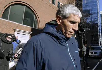 FILE - William "Rick" Singer founder of the Edge College & Career Network, departs federal court in Boston, on March 12, 2019. The mastermind of the nationwide college admissions bribery scandal is set to be sentenced on Wednesday, Jan. 4, 2023, after helping authorities secure the convictions of a slew of wealthy parents involved in his scheme to rig the selection process at top-tier schools. (AP Photo/Steven Senne, File)