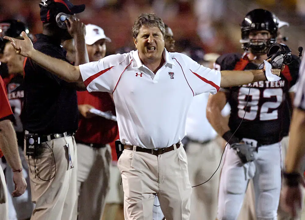 FILE - Texas Tech coach Mike Leach yells at officials during an NCAA college football game against North Dakota in Lubbock, Texas, Sept. 5, 2009. Mike Leach, the gruff, pioneering and unfiltered college football coach who helped revolutionize the passing game with the Air Raid offense, has died following complications from a heart condition, Mississippi State said Tuesday, Dec. 13, 2022. He was 61. (Geoffrey McAllister/Lubbock Avalanche-Journal via AP)