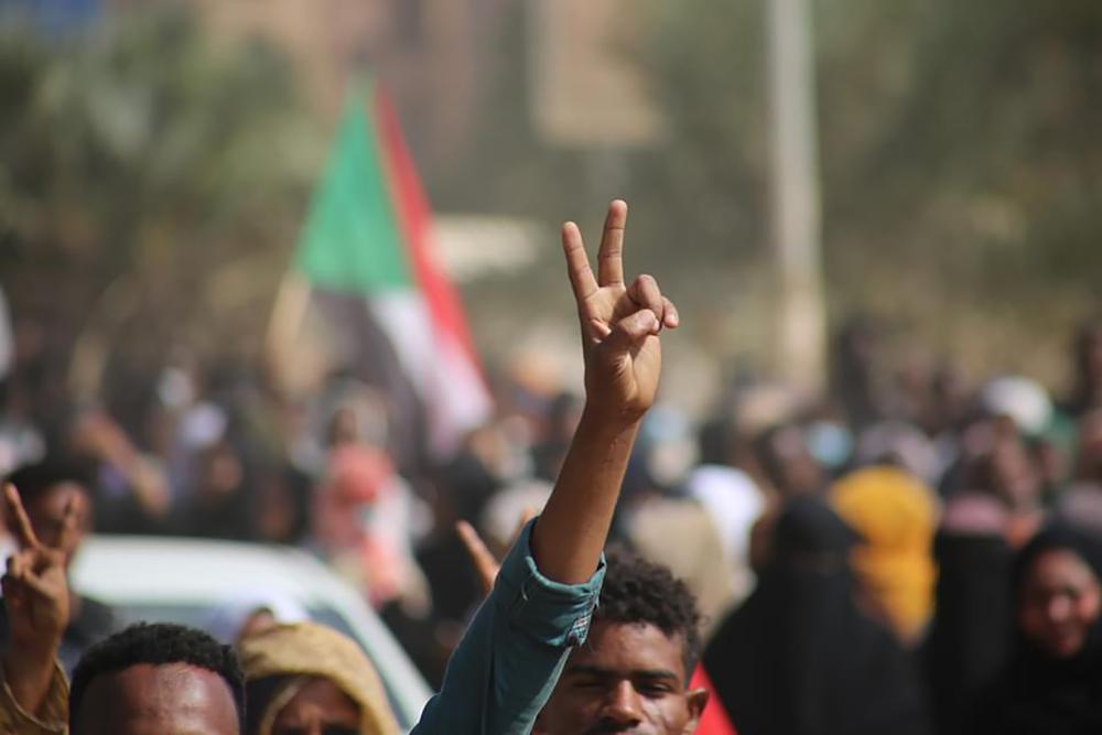 Protesters burn tires, block roads in Sudan a day after coup