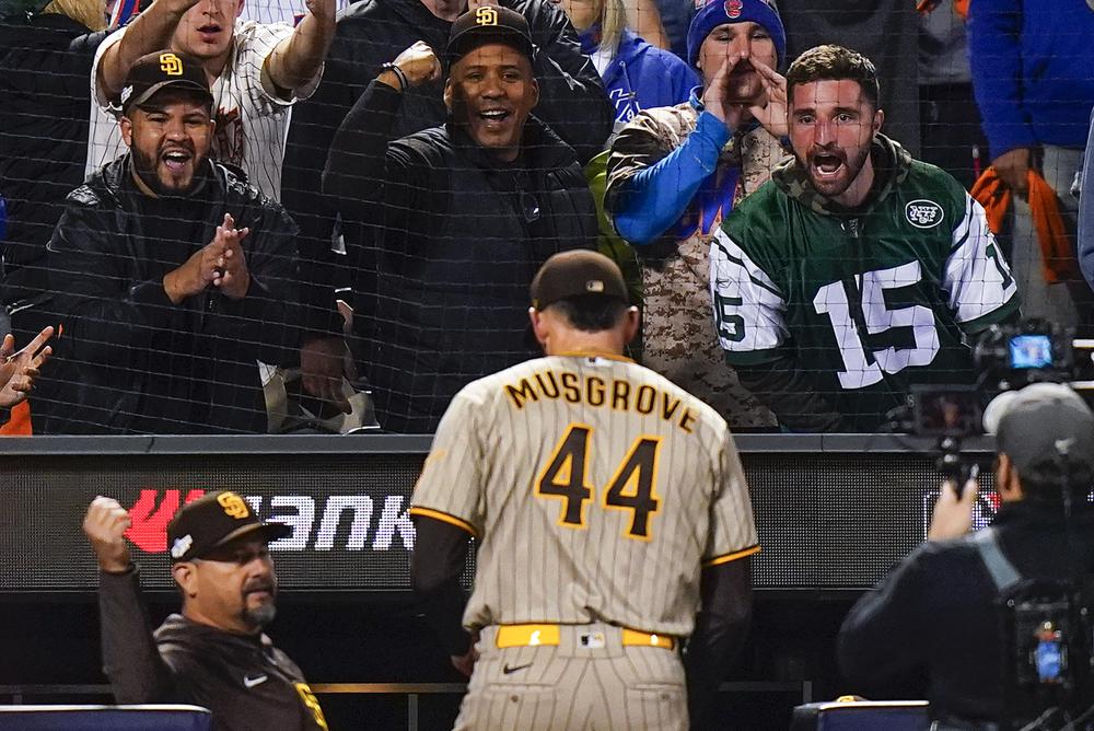 Baseball fans react as San Diego Padres starting pitcher Joe Musgrove (44) walks off the field at the end of the seventh inning of Game 3 of a National League wild-card baseball playoff series against the New York Mets, Sunday, Oct. 9, 2022, in New York. (AP Photo/Frank Franklin II)