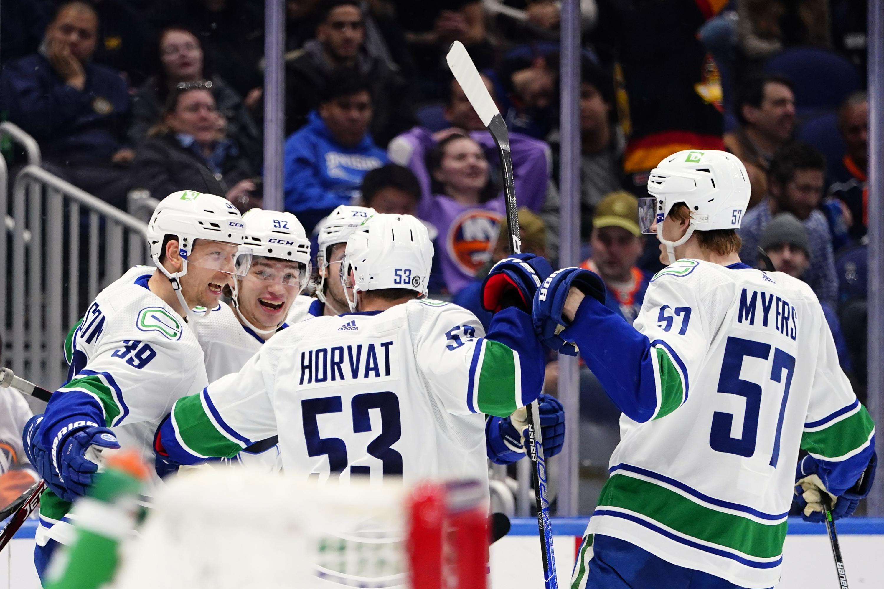 Canucks score twice early in third, rally past Islanders 43 AP News