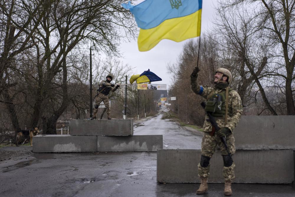 FILE - Ukrainian soldiers celebrate at a check point in Bucha in the outskirts of Kyiv Ukraine April 3 2022 Kyiv was a Russian defeat for the ages It started poorly for the invaders and went downhill from there  AP PhotoRodrigo Abd File