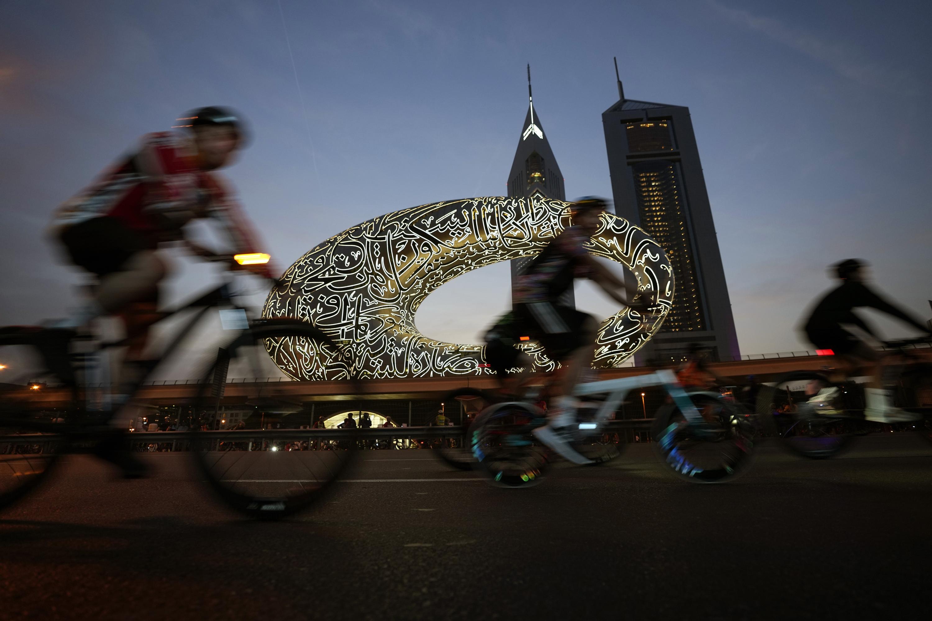 Tens of thousands ride bikes on typically busy Dubai highway AP News