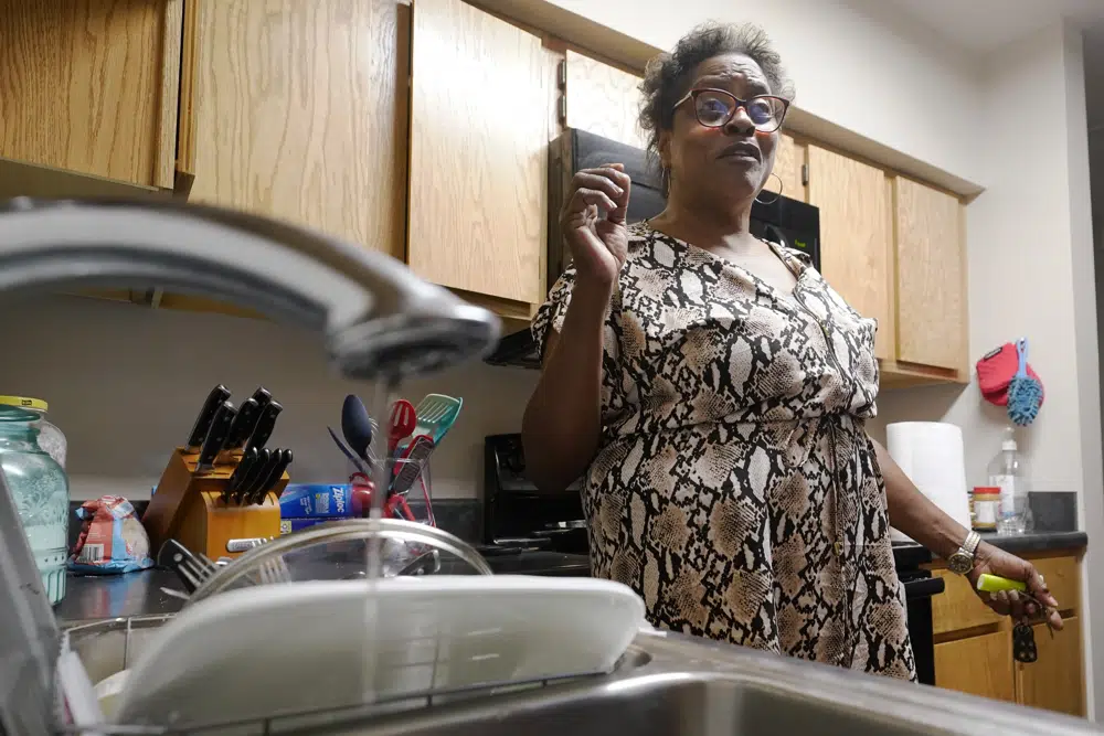 FILE - A trickle of water comes out of the faucet at Mary Gaines' Golden Keys Senior Living apartment in Jackson, Miss., Sept. 1, 2022. The federal government will put $600 million toward repairing the troubled water system in Mississippi's capital city...a project that the mayor has said could cost billions of dollars. Funding for Jackson, Miss., water is included in a $1.7 trillion federal spending bill that passed the Senate on Thursday, Dec. 22, and the House on Friday, Dec. 23. President Joe Biden is expected to sign it into law. (AP Photo/Steve Helber, File)