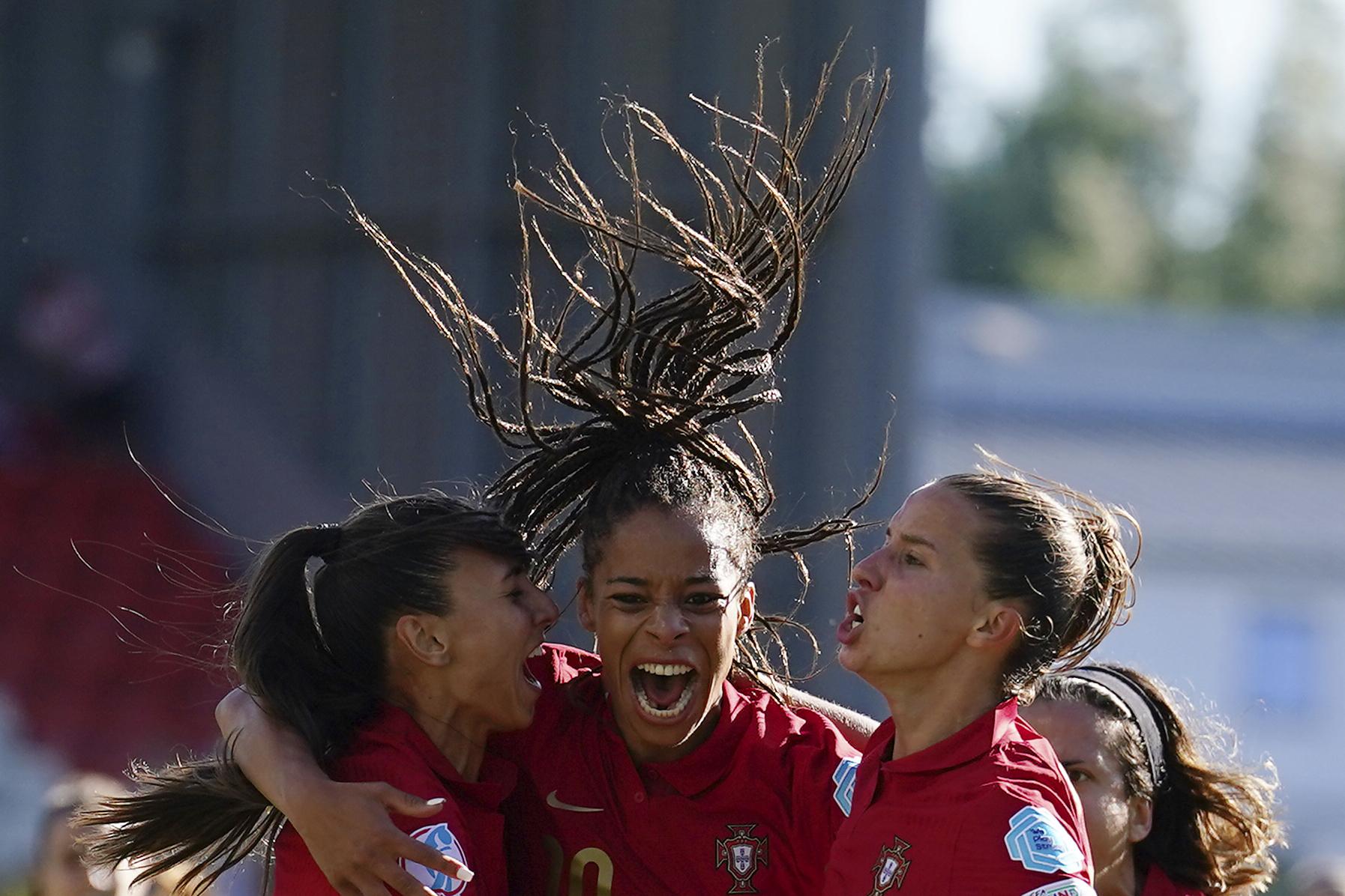 FILE - Portugal's Jessica Silva, center, celebrates with her teammates after scoring his side's second goal during the Women Euro 2022 soccer match between Portugal and Switzerland at Leigh Sports Village in Wigan & Leigh, England, Saturday, July 9, 2022. (AP Photo/Dave Thompson, File)