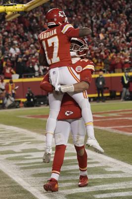 Kansas City Chiefs wide receiver Mecole Hardman (17) celebrates with teammate Patrick Mahomes after scoring on a 25-yard touchdown run during the second half of an NFL divisional round playoff football game against the Buffalo Bills, Sunday, Jan. 23, 2022, in Kansas City, Mo. (AP Photo/Charlie Riedel)