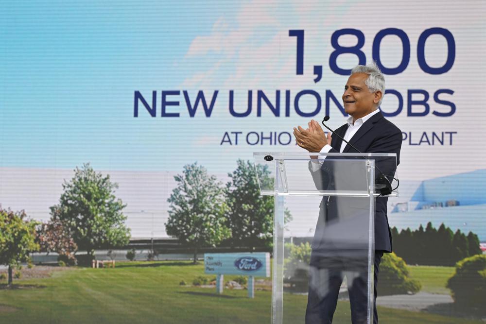 Kumar Galhotra, president of Ford Blue, the company's division that makes internal combustion vehicles, speaks during a press conference, Thursday, June 2, 2022, in Avon Lake, Ohio. Ford announced it will add 6,200 factory jobs in Michigan, Missouri and Ohio as it prepares to build more electric vehicles and roll out two redesigned combustion-engine models. (AP Photo/David Richard)