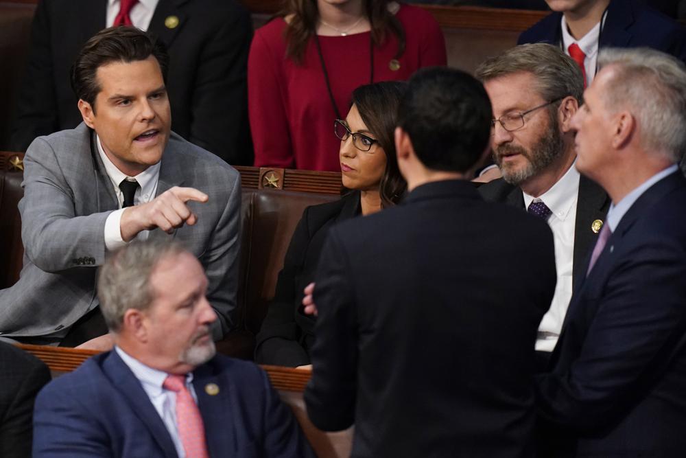 Rep. Matt Gaetz, R-Fla., talks to Rep. Kevin McCarthy, R-Calif., after Gaetz voted "present" in the House chamber as the House meets for the fourth day to elect a speaker and convene the 118th Congress in Washington, Friday, Jan. 6, 2023. (AP Photo/Alex Brandon)