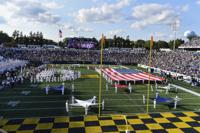 Navy's marching band performs at halftime during an NCAA college football game between Navy and Air Force, Saturday, Sept. 11, 2021, in Annapolis, Md. (AP Photo/Terrance Williams)