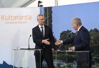 Finland's President Sauli Niinisto meets with NATO Secretary General Jens Stoltenberg, left, shake hands at a press conference during Kultaranta Talks, at the presidential summer residence Kultaranta in Naantali, Finland, Sunday June 12, 2022. (Markku Ulander/Lehtikuva via AP)