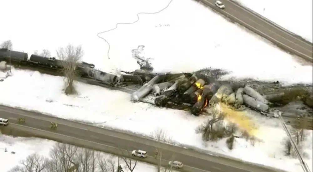 This photo provided KSTP, emergency personnel respond to the scene of a train derailment early Thursday, March 30, 2023 in Raymond, Min. A train hauling ethanol and corn syrup derailed and caught fire and nearby residents were ordered to evacuate their homes, authorities said. (KSTP via AP)