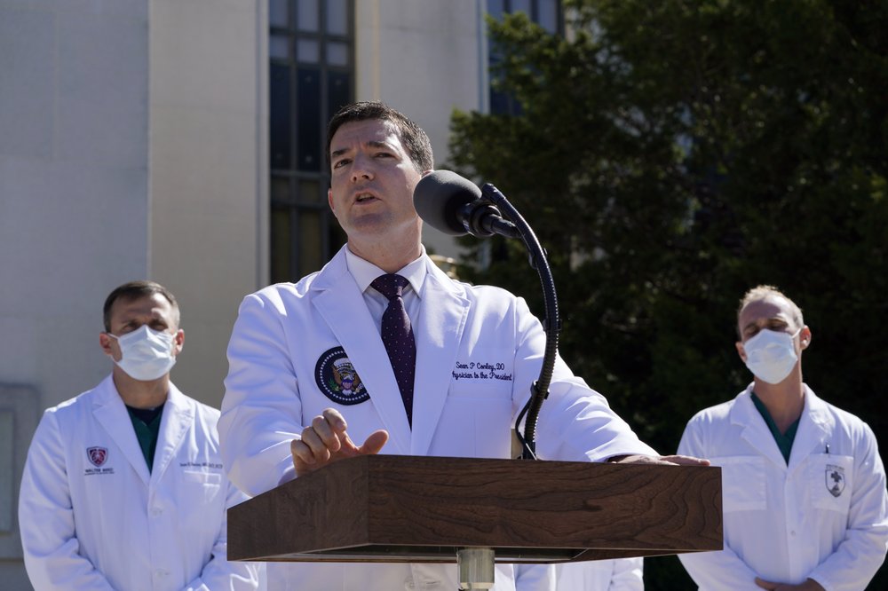 Dr. Sean Conley, physician to President Donald Trump, briefs reporters at Walter Reed National Military Medical Center in Bethesda, Md., Saturday, Oct. 3, 2020. Trump was admitted to the hospital after contracting the coronavirus. (AP Photo/Susan Walsh)