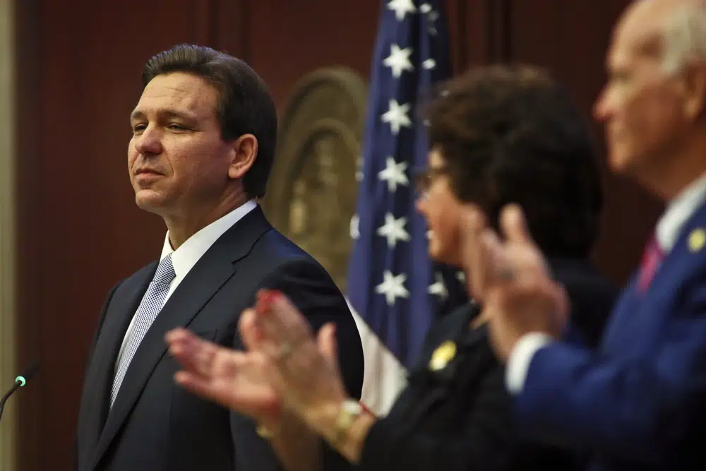 Florida Gov. Ron DeSantis gives his State of the State address during a joint session of the Senate and House of Representatives Tuesday, March 7, 2023, at the Capitol in Tallahassee, Fla. (AP Photo/Phil Sears)