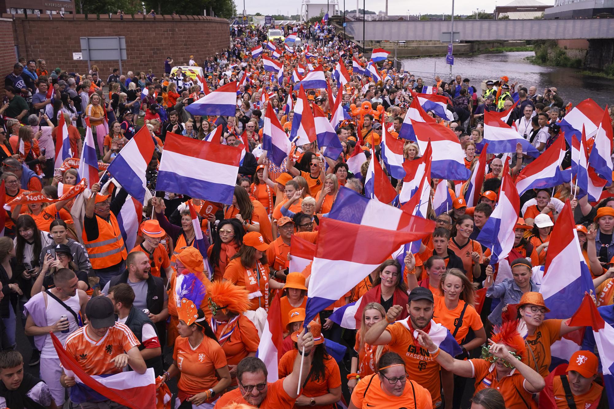 FILE - Netherlands supporters arrive at the stadium for the Women Euro 2022 quarterfinals soccer match between France and the Netherlands at the New York Stadium in Rotherham, England, Saturday, July 23, 2022. (AP Photo/Jon Super, File)