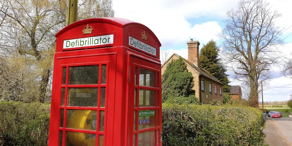 This handout photo provided by Community Heartbeat Trust shows a telephone booth converted into a defibrillator in Shenton, England, on April 16, 2021. On Jan. 18, 2023, The Associated Press reported on online claims that used videos of a similar defibrillator to falsely claim the devices were installed as a result of COVID-19 vaccines. (Community Heartbeat Trust via AP)