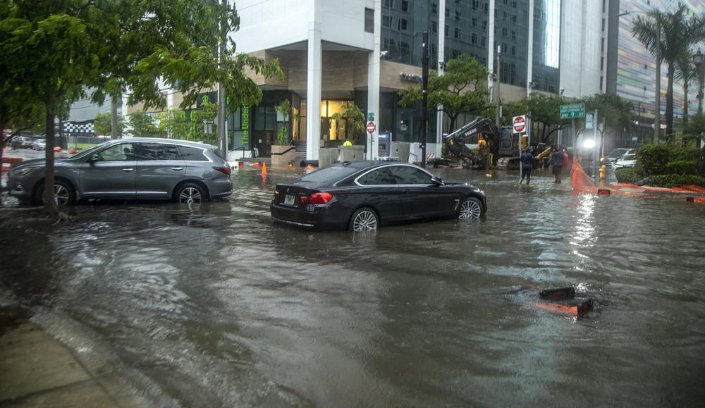 Rainfall from Tropical Storm Alex floods the Brickell area near downtown Miami, Saturday June 4, 2022. (Pedro Portal/Miami Herald via AP)