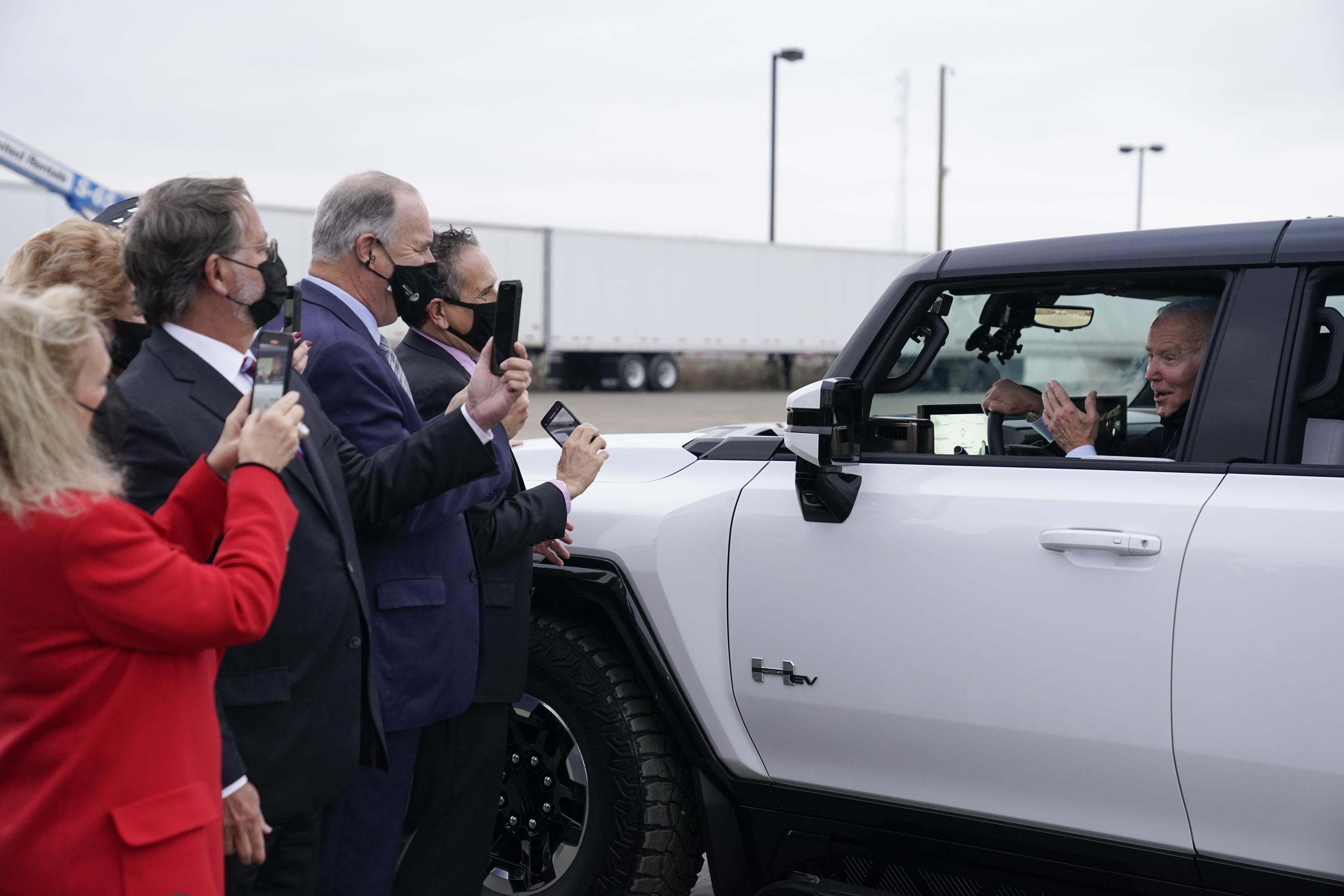 Biden pushes electric vehicle chargers as energy costs spike AP News