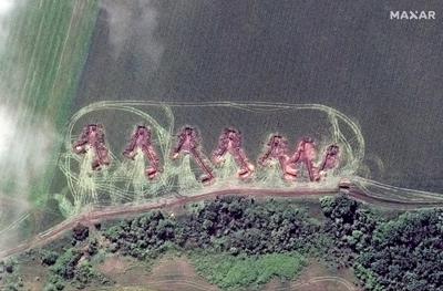 This satellite image provided by Maxar Technologies shows towed artillery in firing position deployed in the north of Lyman, Ukraine, Thursday May 26, 2022. (Satellite image ©2022 Maxar Technologies via AP)