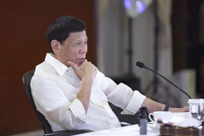 In this photo provided by the Malacanang Presidential Photographers Division, Philippine President Rodrigo Duterte gestures during a meeting with government officials at the Malacanang presidential palace in Manila, Philippines on Monday May 23, 2022. Outgoing Philippine President Duterte sharply criticized Russian leader Vladimir Putin for the killings of innocent civilians in Ukraine, saying while the two of them have been tagged as killers, “I kill criminals, I don’t kill children and the elderly.” (Valerie Escalera/Malacanang Presidential Photographers Division via AP)