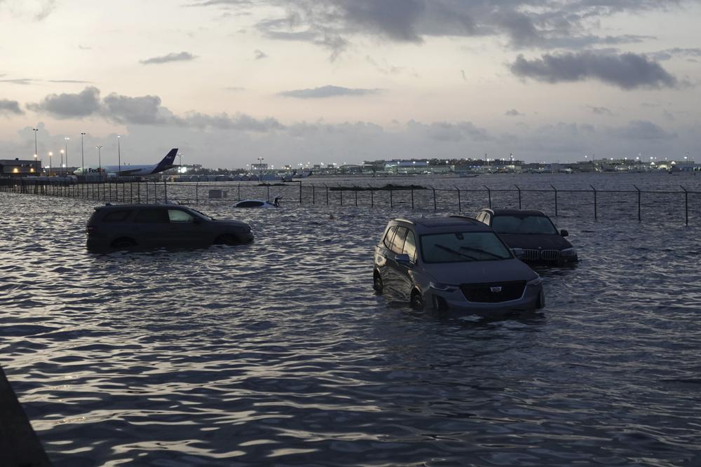 Flooding lingers at Fort Lauderdale-Hollywood International Airport on Thursday, April 13, 2023 after heavy rain pounded South Florida on Wednesday. South Florida is keeping a wary eye on a forecast that calls for rain a day after nearly a foot fell in a matter of hours. The rains caused widespread flooding, closed the Fort Lauderdale airport and turned thoroughfares into rivers. (Joe Cavaretta /South Florida Sun-Sentinel via AP)