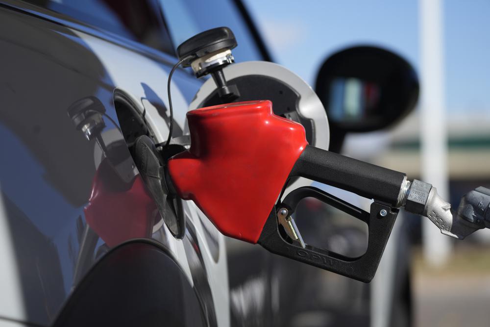 FILE - A motorist fuels a vehicle at an Exxon station Oct. 27, 2021, in Littleton, Colo. President Joe Biden is warning Americans already exhausted by inflation at a 40-year high that gas prices could get higher if Russian President Vladimir Putin chooses to invade Ukraine. (AP Photo/David Zalubowski, File)