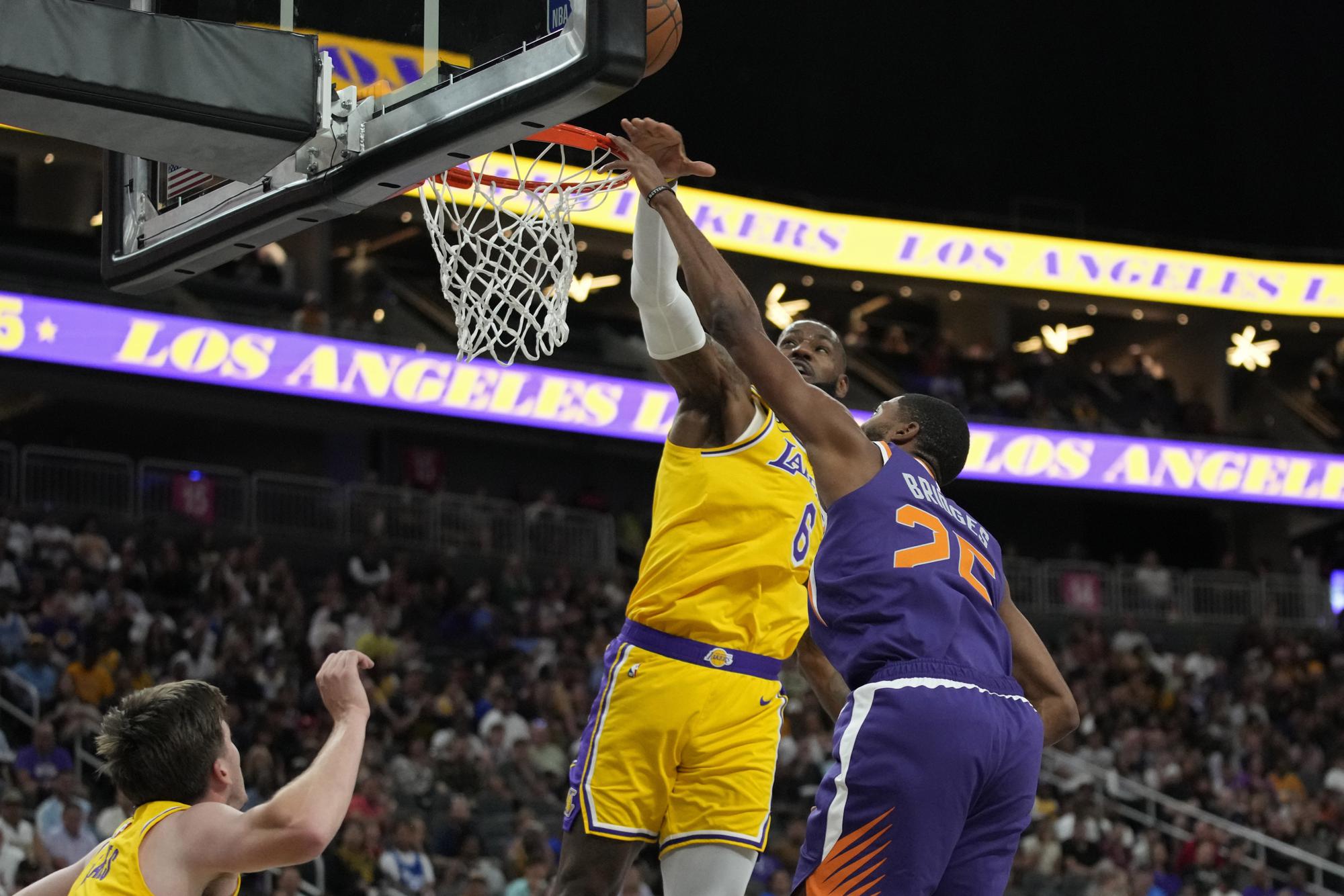 James scores 23 points, but not enough as Suns defeat Lakers | AP News