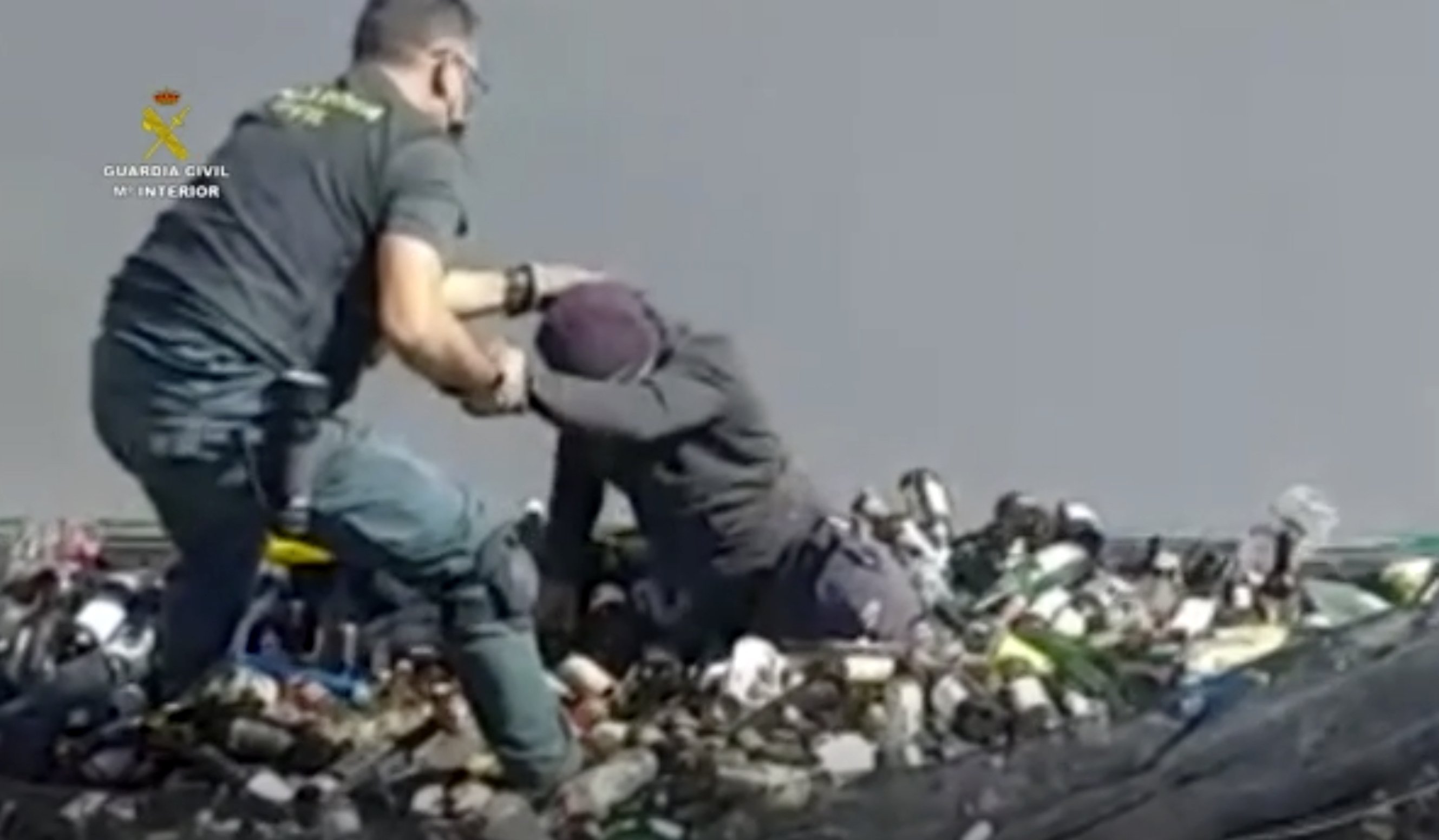 European migrants found it in the middle of broken glass and toxic ash