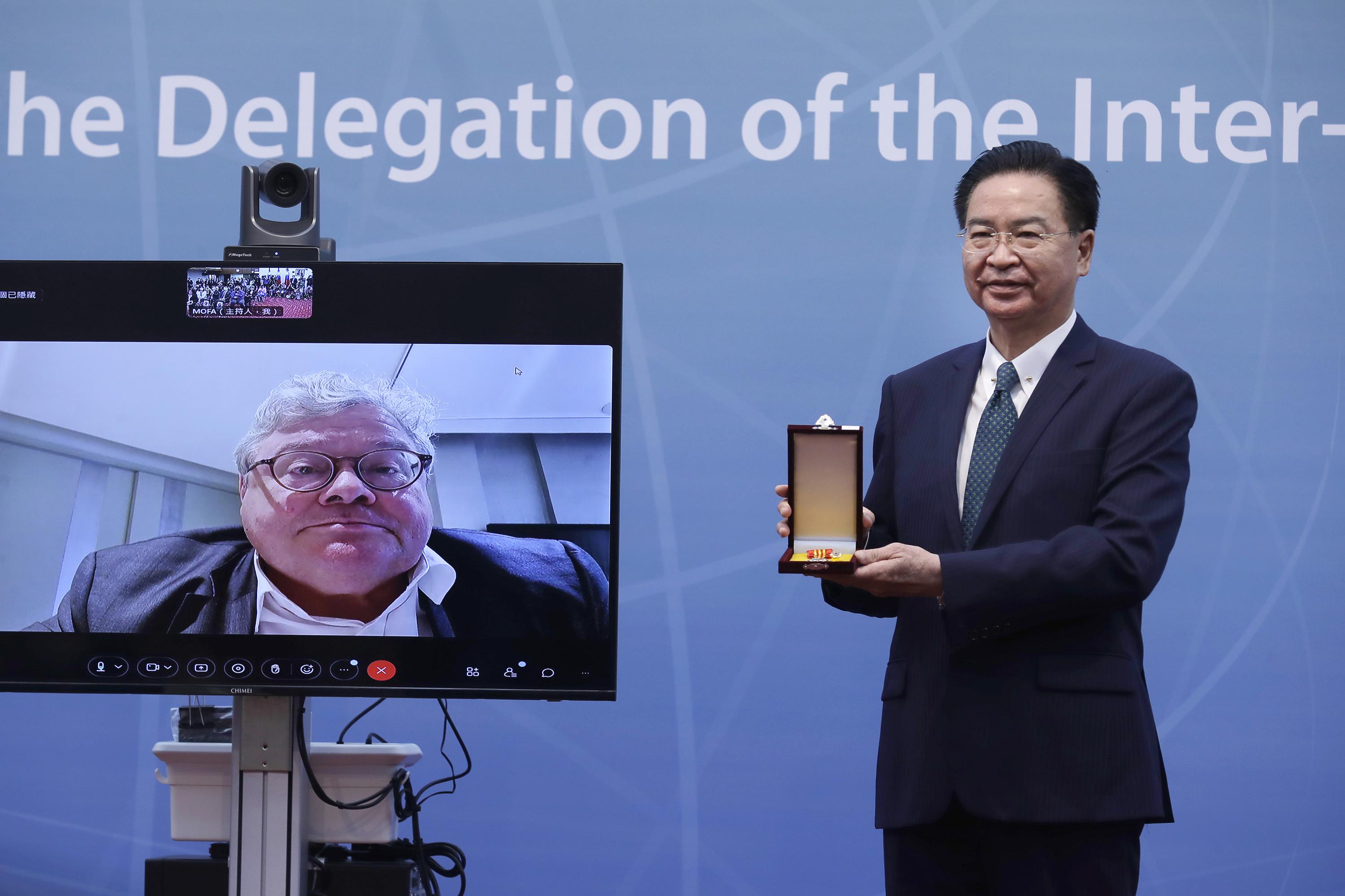 German chancellor’s China visit sparks debate at home