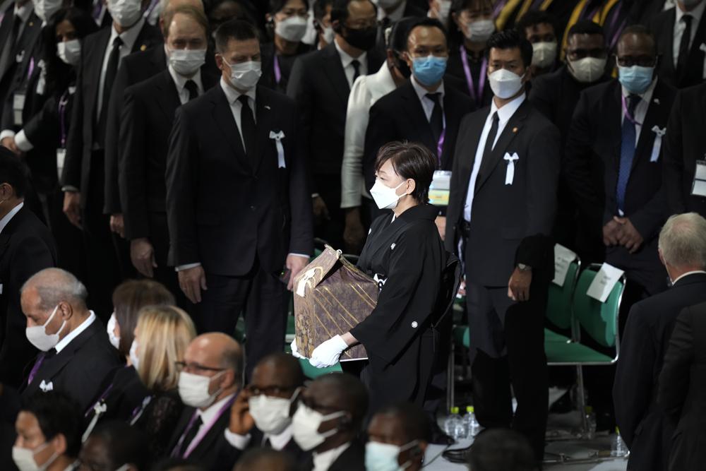 Akie Abe, widow of former Prime Minister of Japan Shinzo Abe, arrives with her husband's remains at the state funeral Tuesday Sept. 27, 2022, at Nippon Budokan in Tokyo. (AP Photo/Eugene Hoshiko, Pool) ///