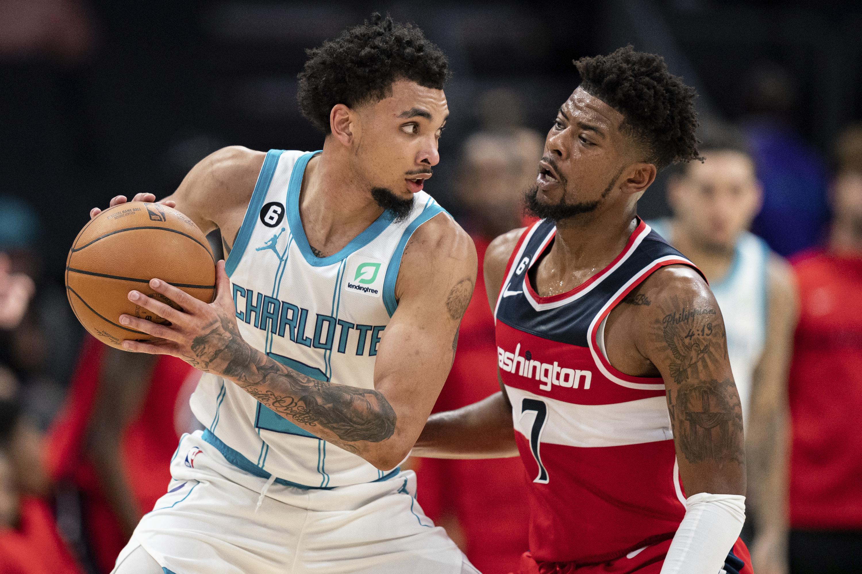 Charlotte Hornets forward Gordon Hayward (20) brings the ball up court  against the Washington Wizards during the first half of an NBA basketball  game in Charlotte, N.C., Wednesday, Nov. 17, 2021. (AP