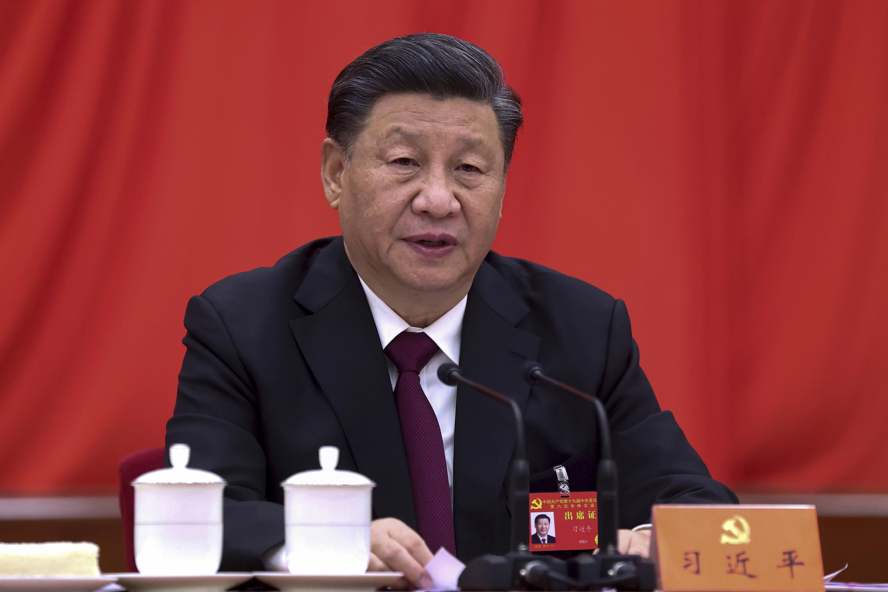 Chinese leaders issue official history to elevate Xi AP News