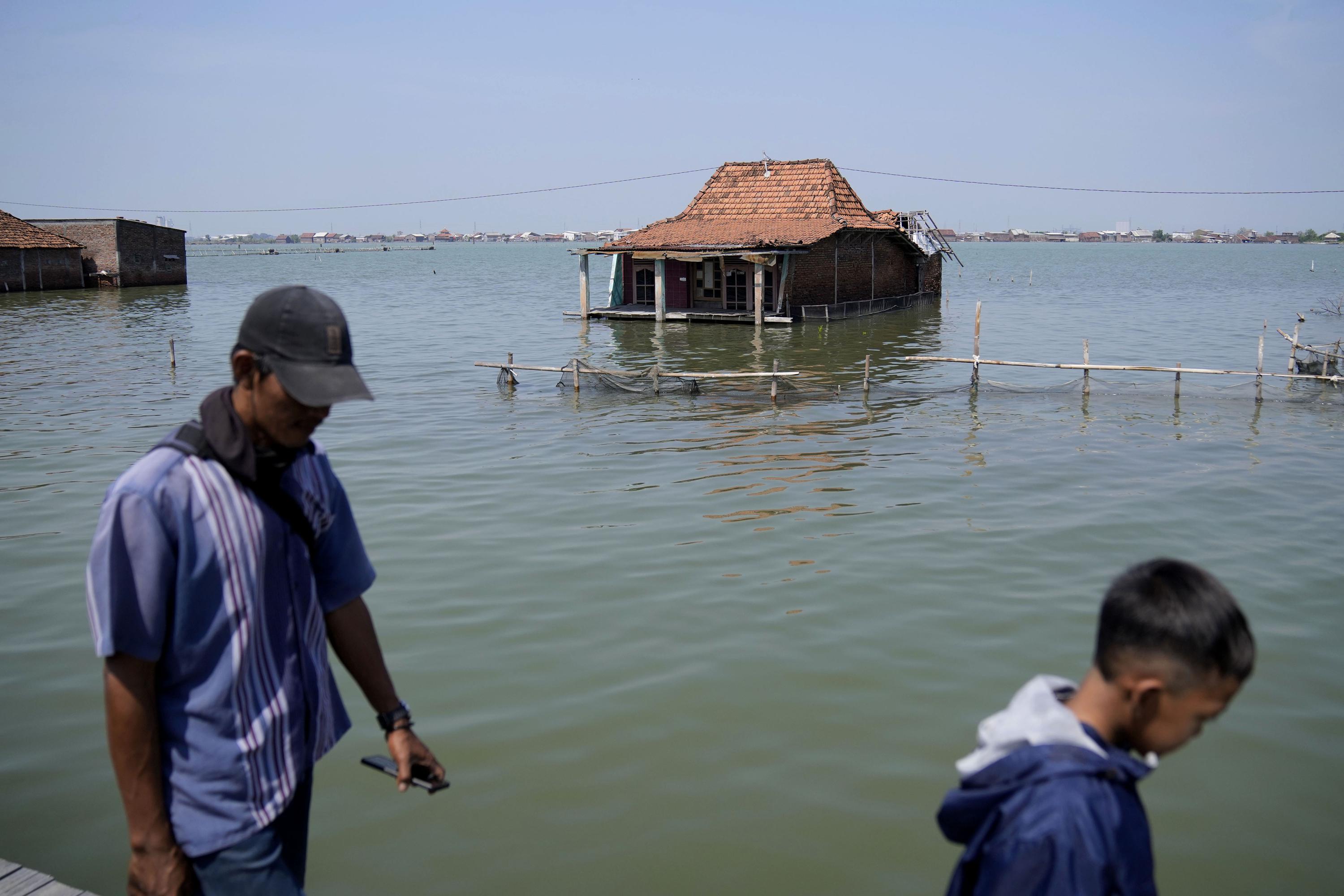 Climate Migration: Floods displace villagers in Indonesia - The Associated Press