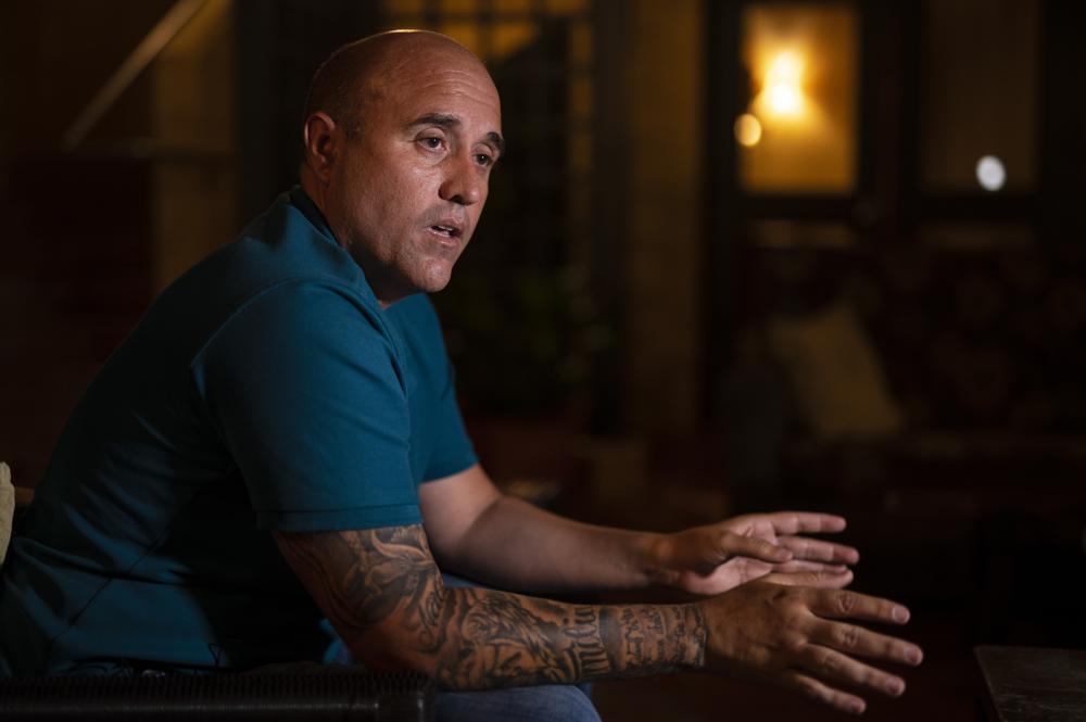 Jose Irizarry, a once-standout DEA agent sentenced to more than 12 years in federal prison for conspiring to launder money with a Colombian cartel, speaks during an interview the night before going to a federal detention center, in San Juan, Puerto Rico, Wednesday, Jan. 5, 2022. Irizarry says dozens of other federal agents, prosecutors, informants and in some cases cartel smugglers themselves were all in on the three-continent joyride known as “Team America” that chose cities for money laundering pick-ups mostly for party purposes or to coincide with Real Madrid soccer or Rafael Nadal tennis matches. (AP Photo/Carlos Giusti)