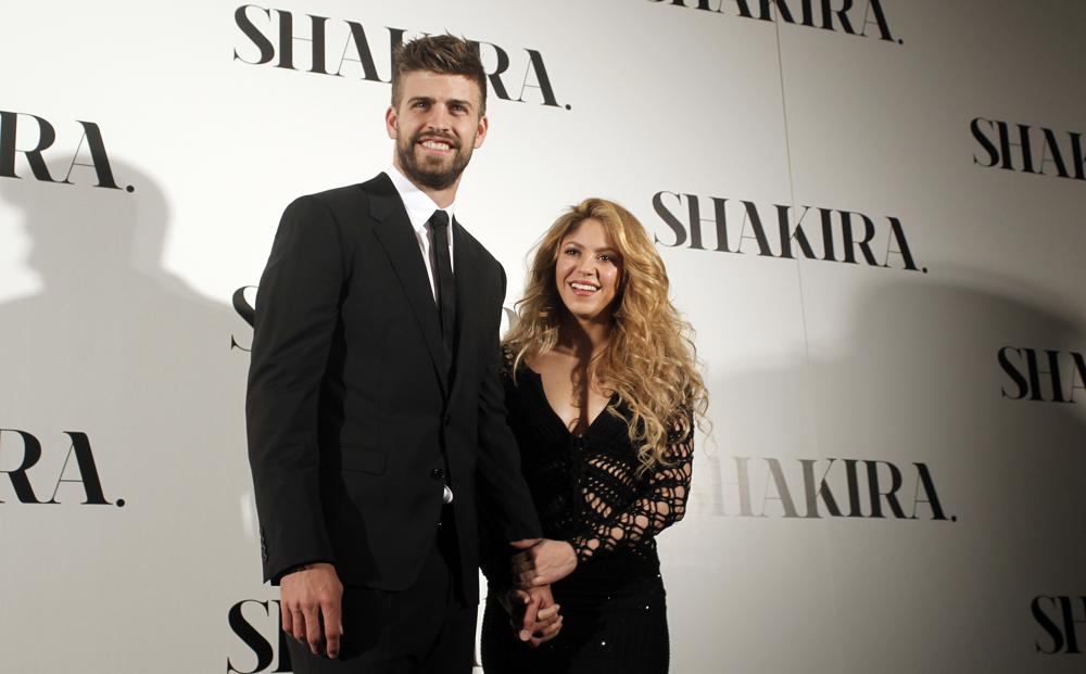 FILE - Colombian singer Shakira, right, and FC Barcelona's soccer player Gerard Pique pose to the media during the presentation of her new album "Shakira" in Barcelona, Spain, on March 20, 2014. Colombian pop star Shakira and her partner, Spanish soccer star Gerard Piqué, are separating. In a statement released on Saturday by Shakira's PR firm, the pair said: “We regret to confirm that we are separating. For the well-being of our children, who are our highest priority, we ask that you respect our privacy. (AP Photo/Manu Fernandez, File)