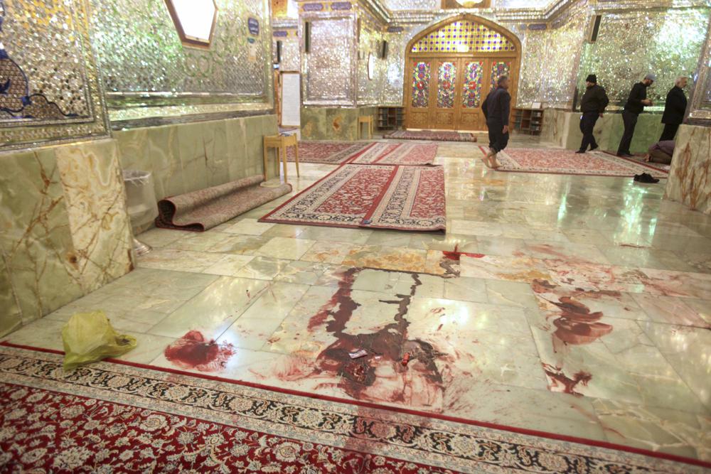 EDS NOTE: GRAPHIC CONTENT - Blood is seen on the ground after gunmen attacked the Shah Cheragh shrine in the southern city of Shiraz, Iran, Wednesday, Oct. 26, 2022. Gunmen attacked the major Shiite holy site in Iran on Wednesday, killing at least 15 people and wounding dozens. The attack came as protesters elsewhere in Iran marked a symbolic 40 days since a woman's death in custody ignited the biggest anti-government movement in over a decade. (Mohammadreza Dehdari/Iranian Students' News Agency, ISNA, via AP)