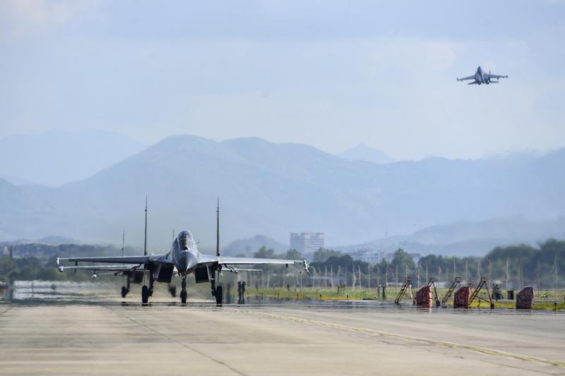 FILE - In this photo released by China's Xinhua News Agency, air force and naval aviation corps of the Eastern Theater Command of the Chinese People's Liberation Army (PLA) fly planes at an unspecified location in China, Aug. 4, 2022. The Chinese air force is sending fighter jets and bombers to Thailand for a joint exercise with the Thai military on Sunday, Aug. 14, 2022. (Fu Gan/Xinhua via AP, File)