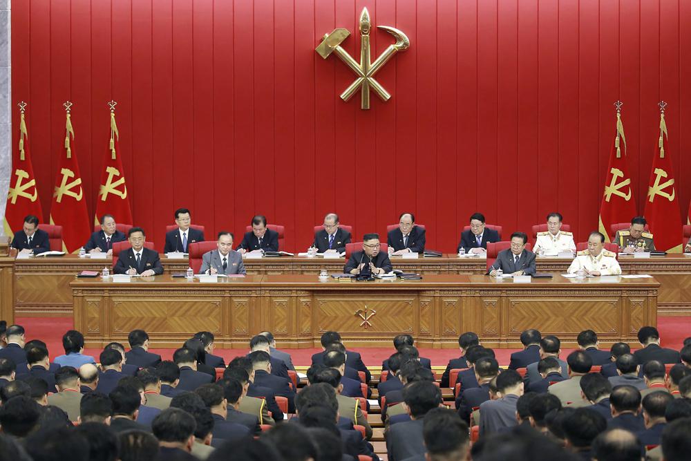 In this photo provided by the North Korean government, North Korean leader Kim Jong Un, center, speaks during a Workers' Party meeting in Pyongyang, North Korea, Tuesday, June 15, 2021. Kim warned about possible food shortages and called for his people to brace for extended COVID-19 restrictions as he opened a major political conference to discuss national efforts to salvage a broken economy. the North’s official Korean Central News Agency said Wednesday, June 16, 2021. Independent journalists were not given access to cover the event depicted in this image distributed by the North Korean government. The content of this image is as provided and cannot be independently verified. (Korean Central News Agency/Korea News Service via AP)