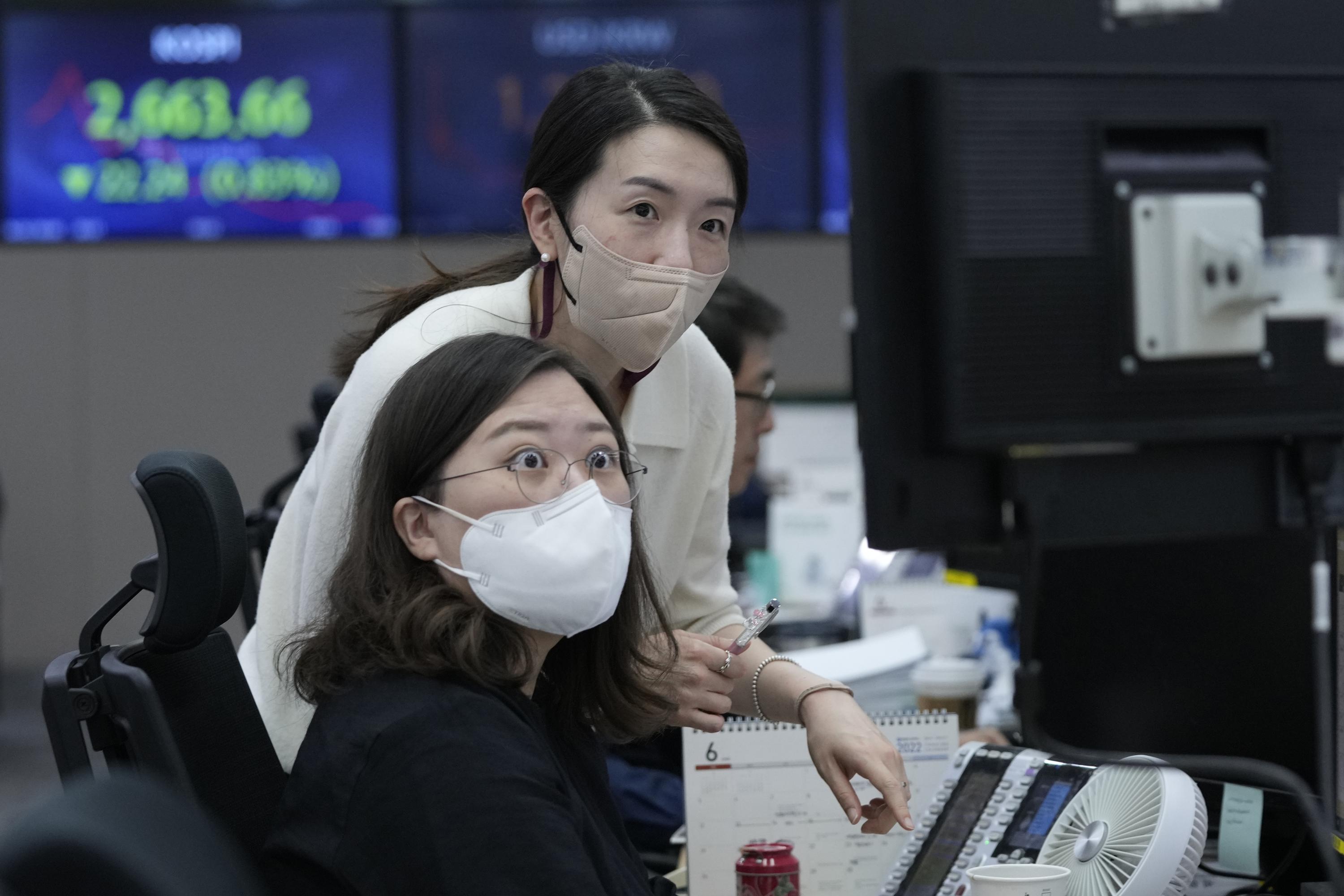 Asia shares slide across board amid rate hike, COVID worries - The Associated Press