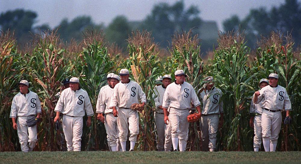 FILE - Persons portraying ghost player characters, similar to those in the film "Field of Dreams," emerge from the cornfield at the "Field of Dreams" movie site in Dyersville, Iowa, in this undated file photo. Three decades after Kevin Costner's character built a ballpark in a cornfield in the movie "Field of Dreams," the iconic site in Dyersville, Iowa, prepares to host the state's first Major League Baseball game at a built-for-the-moment stadium for the Chicago White Sox and New York Yankees. (AP Photo/Charlie Neibergall, File)