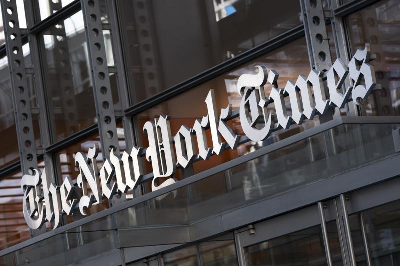 FILE - In this Thursday, May 6, 2021 file photo, a sign for The New York Times hangs above the entrance to its building, in New York. Numerous websites were unavailable on Tuesday June 8, 2021, after an apparent widespread outage at cloud service company Fastly. Dozens of high-traffic websites including the New York Times, CNN, Twitch and the U.K. government's home page, could not be reached. (AP Photo/Mark Lennihan, File)