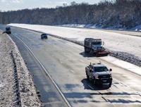 Snow plows pushes snow to the side of northbound Interstate 95 in Spotsylvania County, Va., on Tuesday, Jan. 4, 2022. Hundreds of motorists were stranded on Monday, after a winter storm snarled traffic in Virginia and left some drivers stuck in place for nearly 24 hours in freezing temperatures along an impassable stretch of Interstate 80 south of the nation's capital. (Tristan Lorei