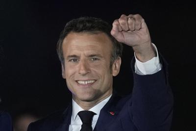 FILE - French President Emmanuel Macron celebrates with his supporters in Paris, France, Sunday, April 24, 2022. French President Emmanuel Macron's reelection has bolstered his standing as a senior player in Europe. Macron is now expected to push for strengthening the 27-nation bloc and throw all his weight behind efforts to end the war in Ukraine. (AP Photo/Christophe Ena, File)